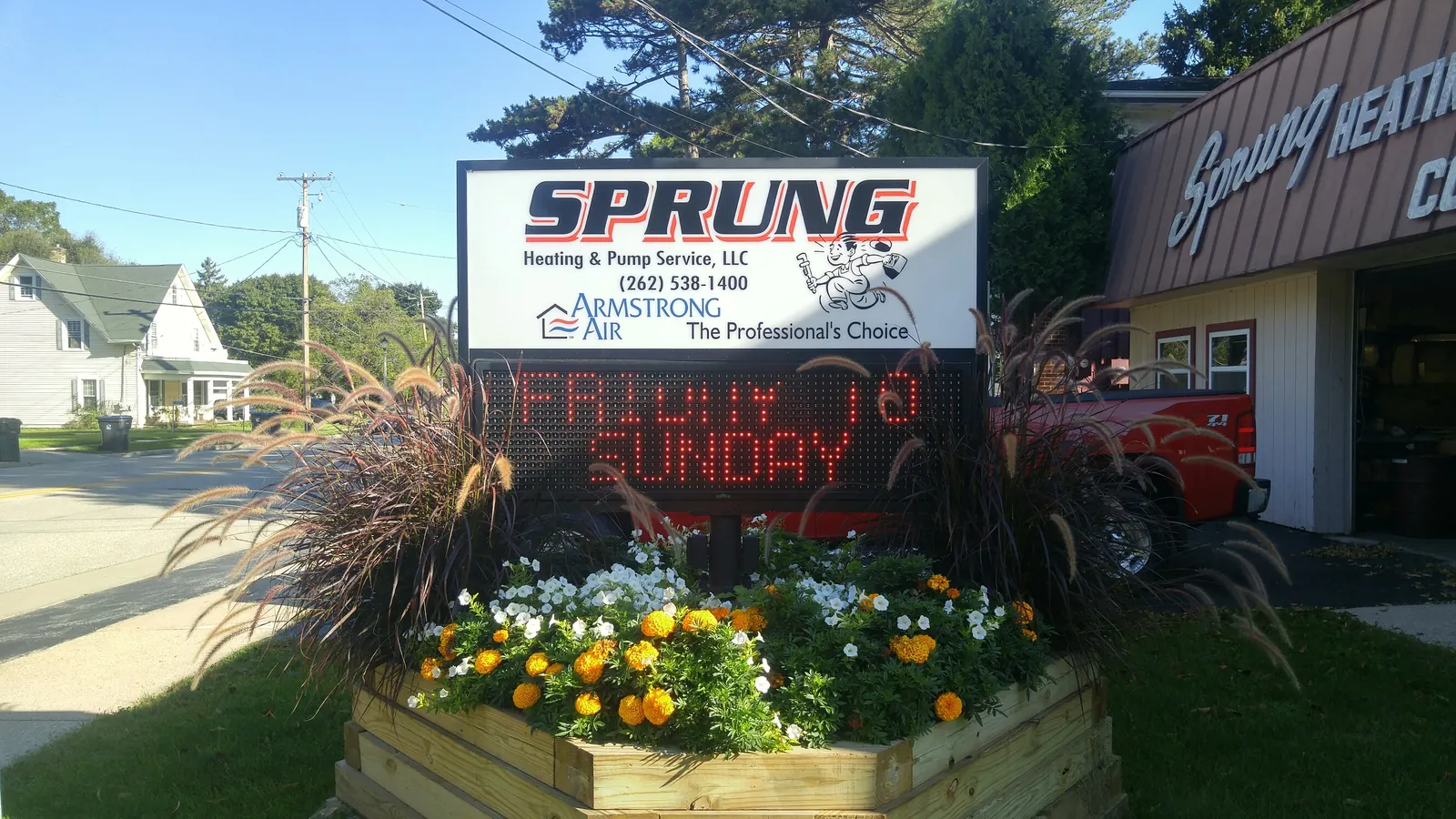 Exterior Signs — Pylon sign with electronic message center for Sprung Heating & Pump Service