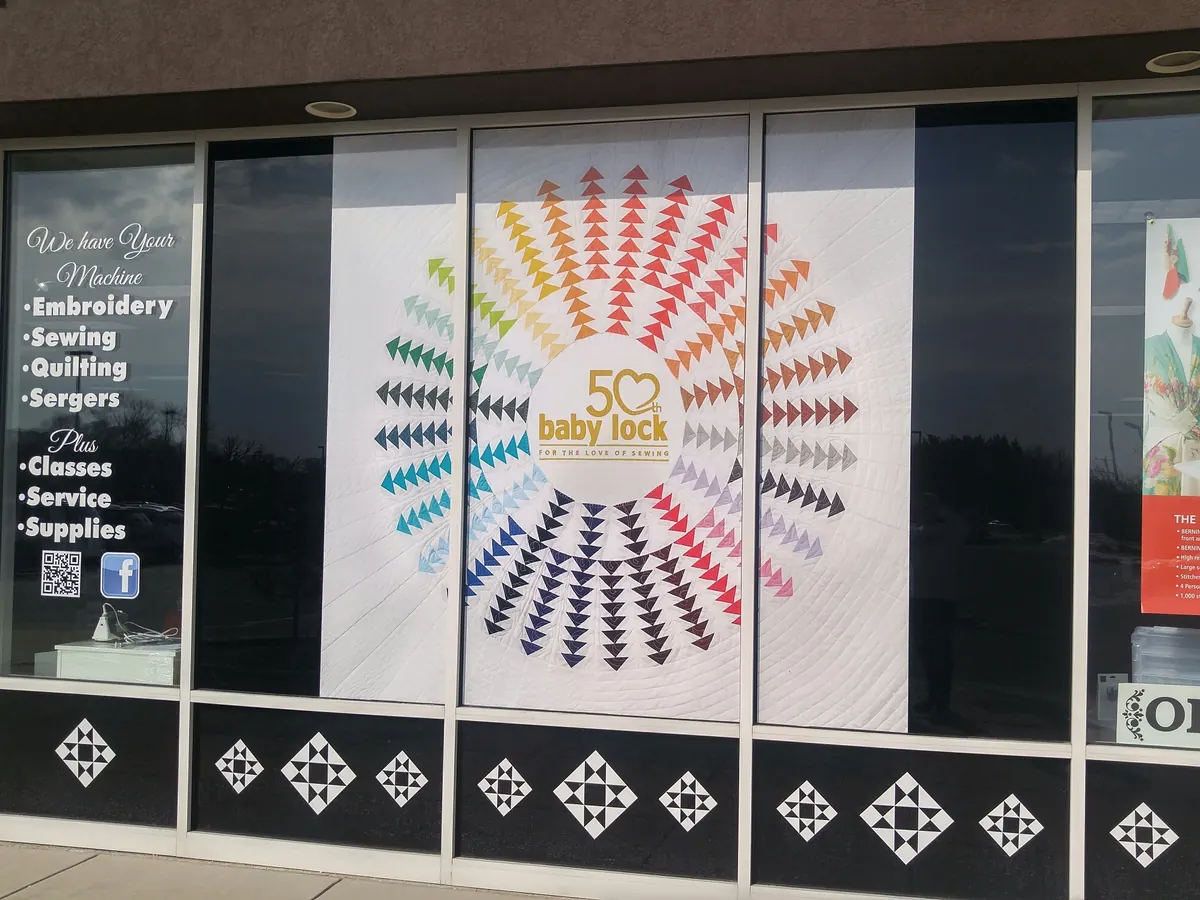Custom window graphics and decals for a sewing and quilting shop storefront